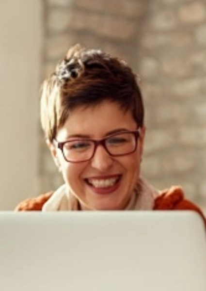 Group of people looking at laptop