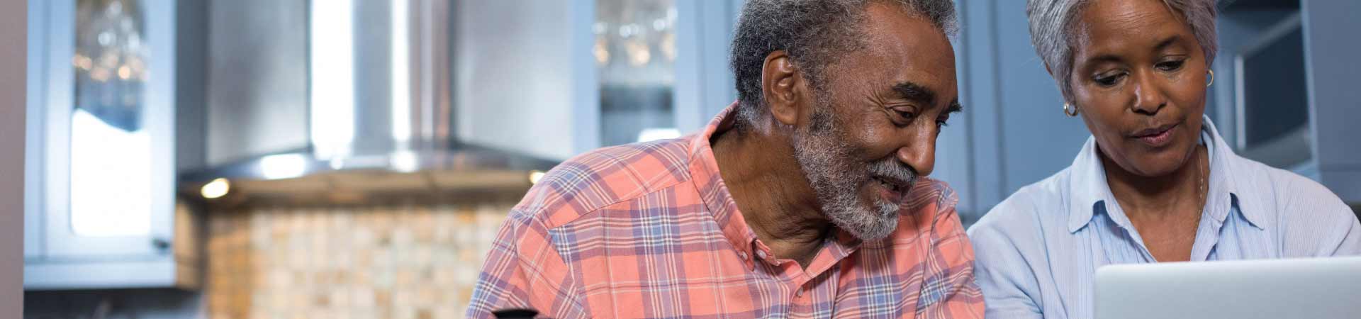 Older couple looking at laptop