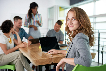 Group Office Meeting with Smiling Woman