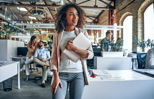 woman holding laptop