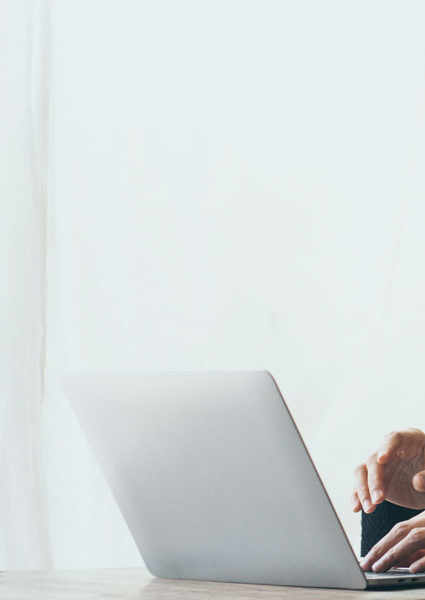 Woman smiling at laptop