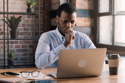 Man studying a laptop