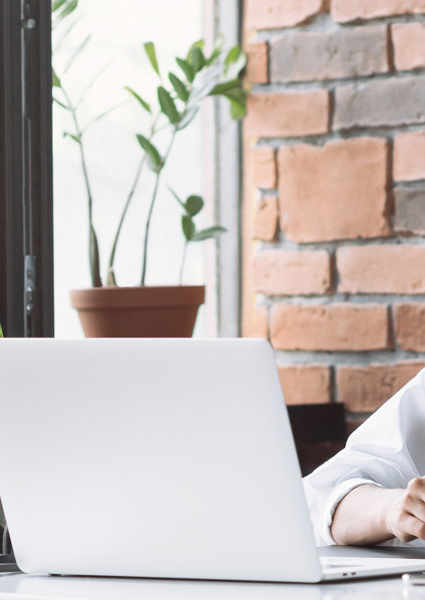 Woman Studying At Laptop
