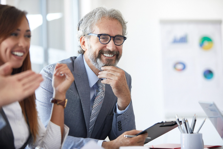 Smiling man with clipboard