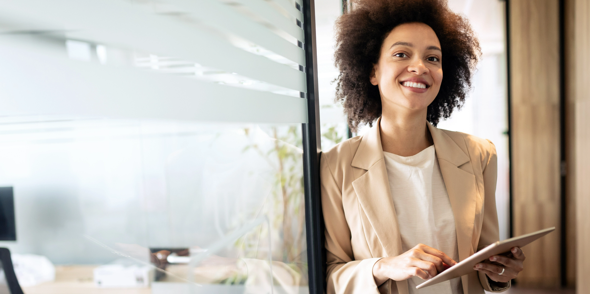 Smiling woman with tablet