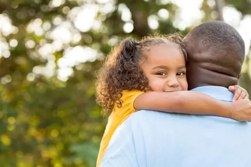 man holding daughter